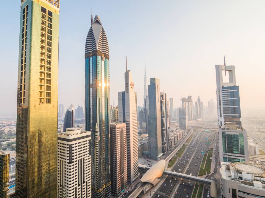Dubai, UAE - October, 2018. Dubai skyline and downtown skyscrapers on sunset. Modern architecture concept with highrise buildings on world famous metropolis in United Arab Emirates